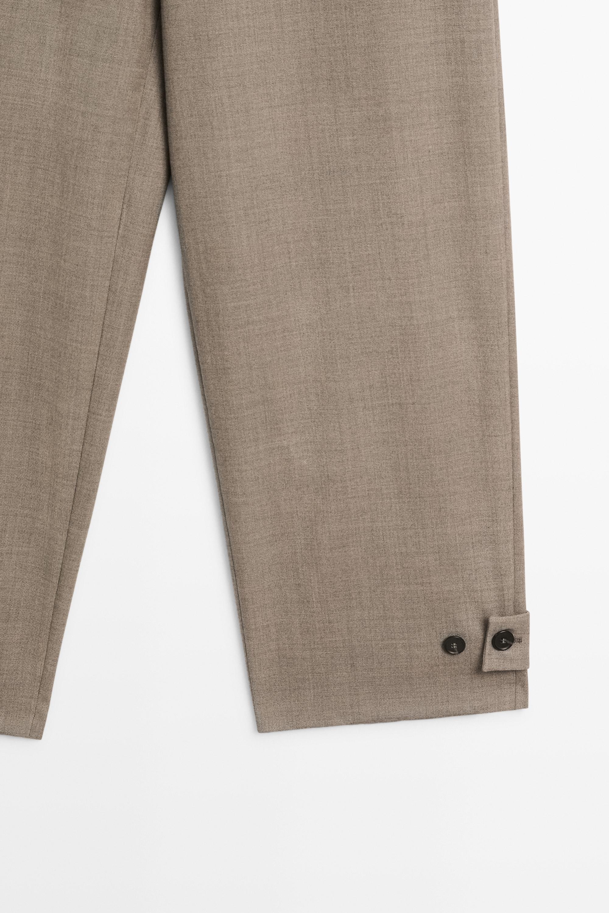 100% wool darted pants with buttoned hem detail